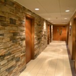 Hallway for treatment rooms, cultured stone and tile.
